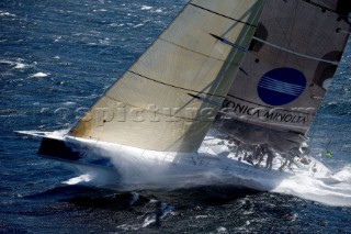 Konica Minolta sailing along the Tasmanian coast, Australia,Dec. 28, 2005. 85 yachts of all sizes battled for this years line honors in this the 61st running of the world famous race.