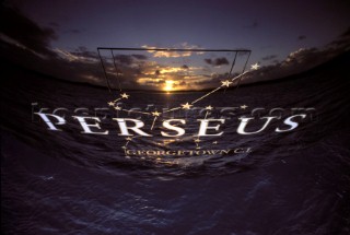 Sunset reflections in the name on the stern of a superyacht