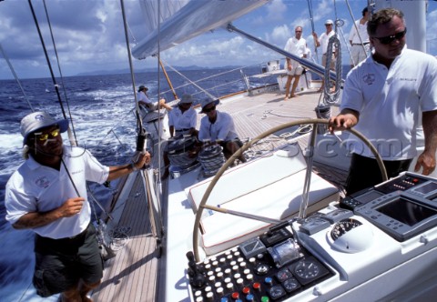 Racing onboard a superyacht with skipper driving boat and navigator navigating