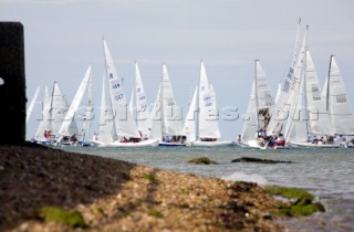 COWES, ENGLAND - JULY 29: Sailors in the 100 boat Laser SB3 Class short tack along the shoreline during Day 1 of Skandia Life Cowes Week 2006. (Photo by Kos/Kos Picture Source via Getty Images)