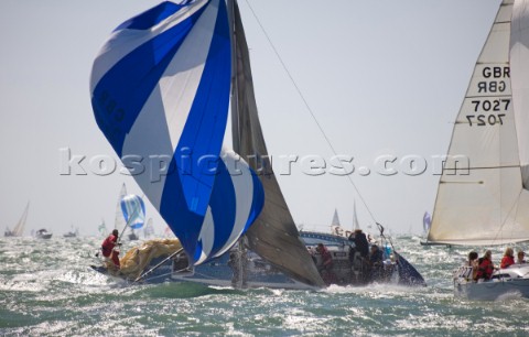 COWES ENGLAND  JULY30 Sailors onboard the yacht GBR 3709 struggle to control the yacht in a broach d