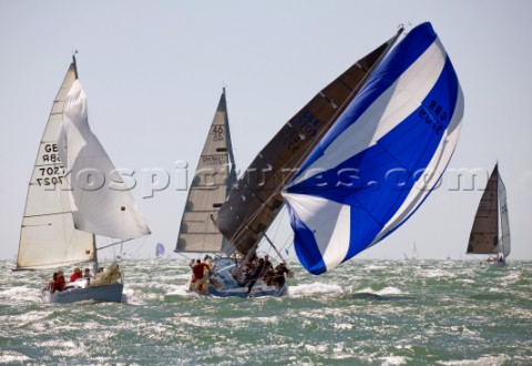 COWES ENGLAND  JULY30 Sailors onboard the yacht GBR 3709 struggle to control the yacht in a broach d