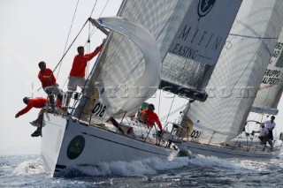 PORTO CERVO, SARDINIA - SEPT 12th 2006: The Swan 45 called DSK (ITA) owned by Danila Salsi leading Swan 45 Star Trading (ITA) owned by Stefano Masi around the windward mark of Race 1 of the Rolex Swan Cup on September 12th 2006. DSK wins the first race, with Star Trading 23rd. The Rolex Swan Cup, started in 1982, is the principle event on the Swan racing circuit. Nautors Swan yachts, celebrating its 40th year in production, build the best series production yachts afloat. (Photo by Tim Wright/Kos Picture Source via Getty Images)
