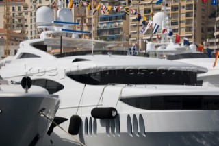 Line up of bows of superyachts and motoryachts moored in harbour at the Monaco Yacht Show