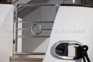 Detail of the stainless steel door entrance and mooring rope onboard a superyacht