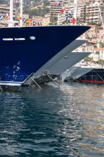 Line up of bows of superyachts and motoryachts moored in harbour at the Monaco Yacht Show