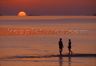 Maldives -. Couple at sunset