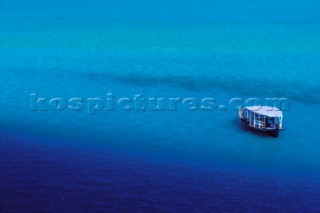 Maldives -. Landscape with lonely boat.