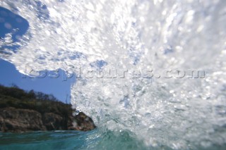 Water from a small breaking wave has the appearance of an ice formation