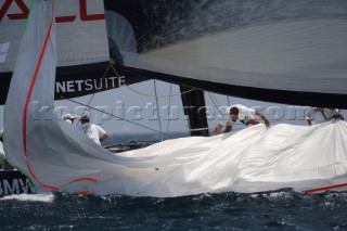 Foredeck crew drop the spinnaker on BMW Oracle
