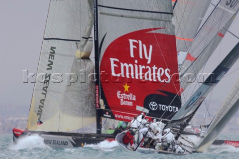 Emirates Team New Zealand NZL84 tacks across the bow of BMW Oracle USA87 on the second beat of race 
