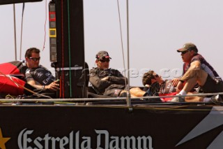Emirates Team New Zealand crew Barry McKay, Dean Barker, Richard Meacham and Don Cowie sit on the foredeck of NZL92 waiting for wind that never comes on day two of the Louis Vuitton Cup. 17/4/2007