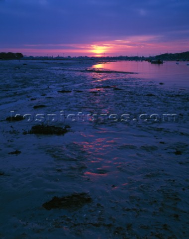 A winter dawn at Bosham Hoe at the waters edge opposite Itchenor looking down the river The wet mud 