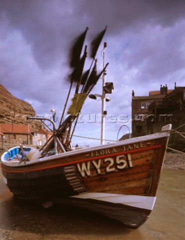 Staithes in Yorkshire is the home port of this traditional fishing boat The varnished wood at the bo