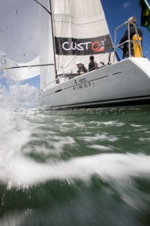 Above and below the water surface as a yacht rounds the windward mark on Day 5 of the Rolex Commodores Cup 2008 in the Solent, UK.