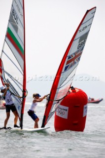 Qingdao, China, 20080807: 2008 OLYMPICS - Practice Race at Olympic Sailing Regatta before the real deal begins on Saturday. Bryony Shaw (GBR) . RS:X Class Women.  (No sale to Denmark)