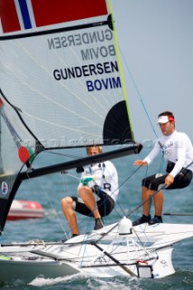 Qingdao, China, 20080809: 2008 OLYMPICS - first day of racing in the Olympic Sailing Event. Christopher Gundersen/Frode Bovim (NOR) - 49er Class.  (no sale to Denmark)