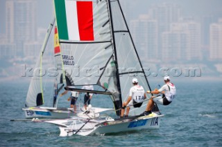 Qingdao, China, 20080809: 2008 OLYMPICS - first day of racing in the Olympic Sailing Event. Gianfranco Sibello/Pietro Sibello (ITA) - 49er Class.  (no sale to Denmark)