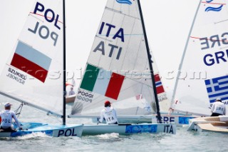 Qingdao, China, 20080809: 2008 OLYMPICS - first day of racing in the Olympic Sailing Event. Giorgio Poggi (ITA) - Finn Class.  (no sale to Denmark)
