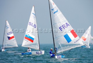 Qingdao, China, 20080809: 2008 OLYMPICS - first day of racing at the Olympic Sailing Event. Guillaume Florent (FRA) - Finn Class.   (no sale to Denmark)