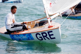 Qingdao, China, 20080809: 2008 OLYMPICS - racing in the Olympic Sailing Event. Emilios Papathanasiou (GRE) - Finn Class.   (no sale to Denmark)