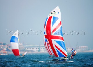 Qingdao, China, 20080810: 2008 OLYMPICS - second day of racing in the Olympic Sailing Event. Stevie Morrison/Ben Rhodes (GBR) - 49er Class.   (no sale to Denmark)