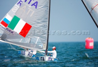 Qingdao, China, 20080810: 2008 OLYMPICS - second day of racing in the Olympic Sailing Event. Giorgio Poggi (ITA) - Finn Class.   (no sale to Denmark)