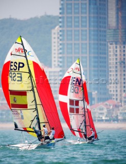 Qingdao, China, 20080810: 2008 OLYMPICS - second day of racing in the Olympic Sailing Event. Jonas Warrer/Martin Kirketerp (DEN) and Iker Martinez and Fernandez (ESP) - 49er Class.   (no sale to Denmark)