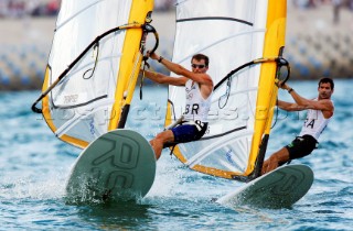 Qingdao, China, 20080811: 2008 OLYMPICS - third day of racing in the Olympic Sailing Event. Nick Dempsey (GBR) and Ricardo Santos (BRA) -  RS:X Class. (no sale to Denmark)
