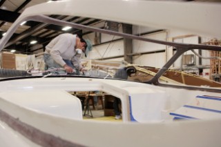 Workmen and boat builders at the Hinkley Shipyard and boat building facility