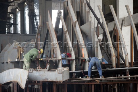 Yacht builders and skilled workers boatbuilding at the Cheoy Lee shipyard and boatbuilders in China 