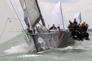 Bow of racing yacht TP52 design cutting through the waves sailing Cowes Week Isle of Wight