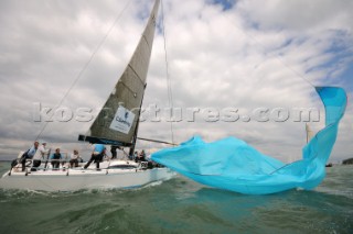 dropping spinnaker on the racing yacht software mistress class 2 IRC sailing Cowes Week Isle of Wight