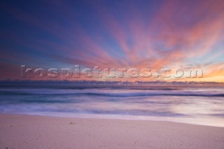 Colourful sunset on a perfect sandy beach