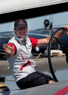 Ernesto Bertarelli driving Alinghi 5, the giant catamaran multihull which will defend the 33rd Americas Cup sailing on Lake Geneva. (Editorial Only)