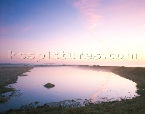 Autumn sunrise at Pennington marshes on the Solent West of Lymington An exceptionally calm morning w