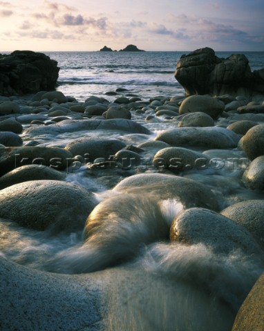 Fresh water stream heading out through the boulders and sand to the Atlantic Limited Edition prints 