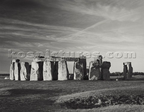 Sunrise at Stonehenge World Heritage site Dawn light bathes the standing stones The site is fenced o