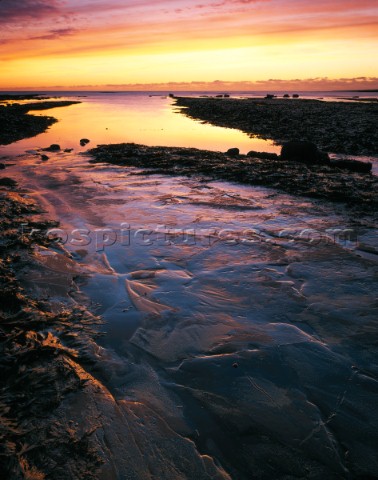 Evening twilight scene on Dorset Jurassic Heritage Coast Tremendously colourful cloud formation make