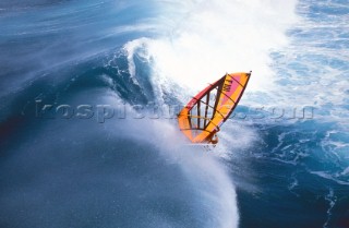 Windsurfer rider big breaking wave