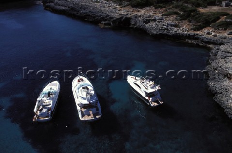 Fairline Squadron 52 Phantom 42 and Targa 43 at a secluded anchorage in clear shallow water