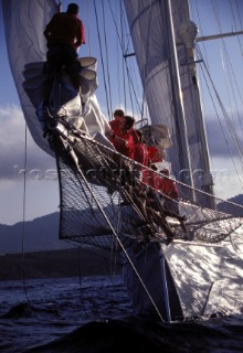 Crew working as a team on the bowsprit of the classic superyacht Adela
