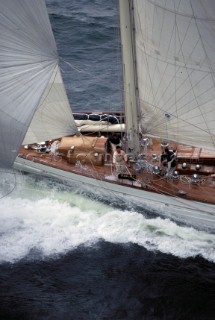 A crew man works on the foredeck of the classic superyacht Adela