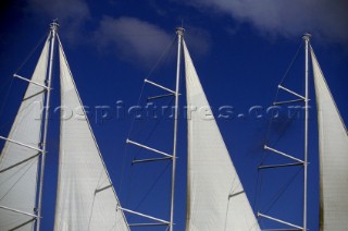 Sails of of cruise liner against a blue sky