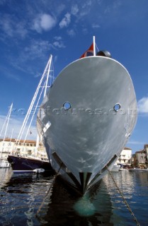 Close up of bow of a superyacht in St Tropez Harbour. Alonside a large sailing superyacht.