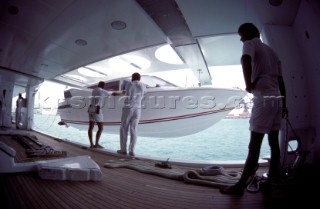 Crew of superyacht preparing to launch tender