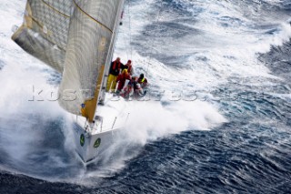 The yacht Cippa Lippa surfing at high speed before storm force winds near Stromboli during the Rolex Middle Sea Race around Malta in the Mediterranean.