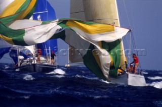 Swan Cup 2000. Fleet of Nautor Swan yachts racing off Porto Cervo. Spinnaker drop.