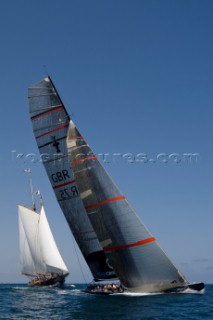 Team Origins GBR-75 makes its maiden voyage from Port Americas Cup in Valencia in company with the yacht America.