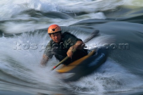 Paddling in churning whitewater at the reversing falls which are caused by tidal flows on the Sheeps